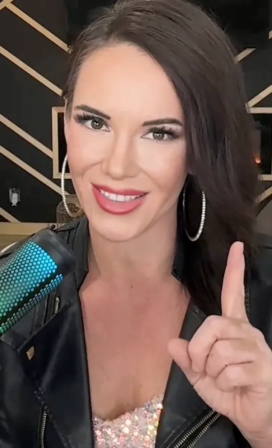 Meg hosting the Stand With Meg show with microphone in studio